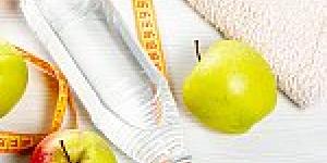 Images representing a healthy lifestyle - apples, water, measuring tape, towels