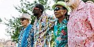 Four older men walking for exercise