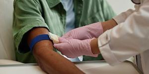 Nurse preparing a patient's arm for a blood test